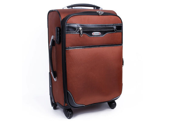 O nylon e mala de viagem de couro do plutônio a grande no trole das rodas encaixotam a bagagem para o curso, esportes